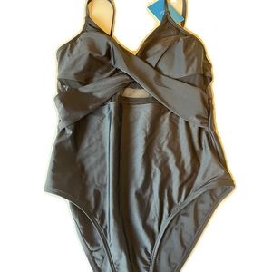 Black high cut one piece with see thru netting‎ on waist. Size M. NWT. Q8.